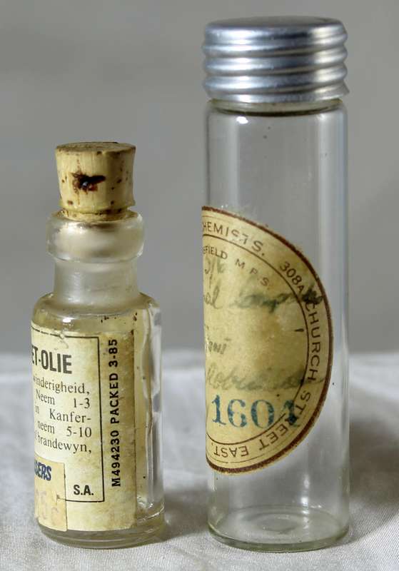 Pair of vintage miniature medicine bottles