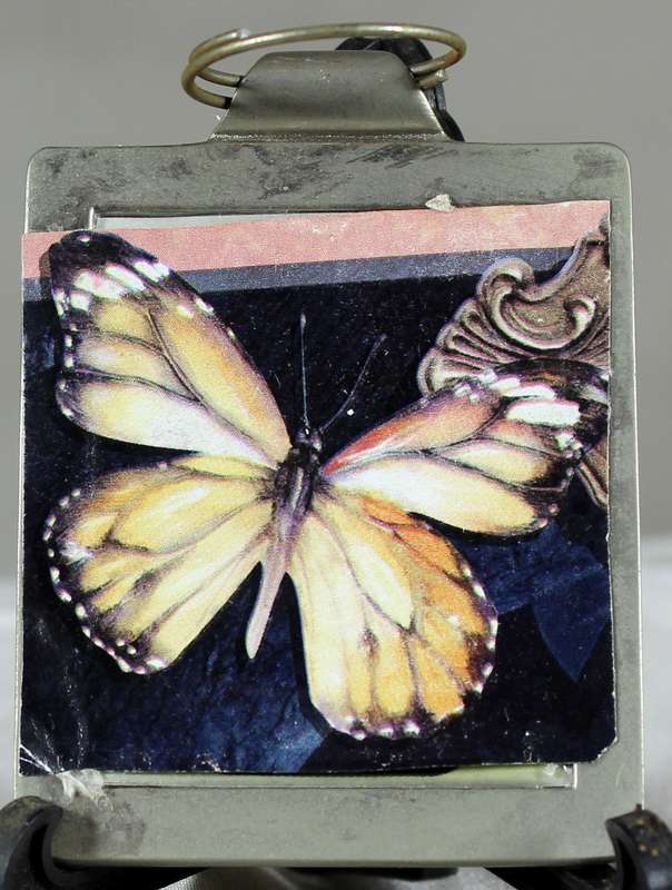 Butterfly on metal pendant