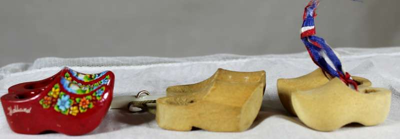 Three pairs of miniature Dutch wooden shoes