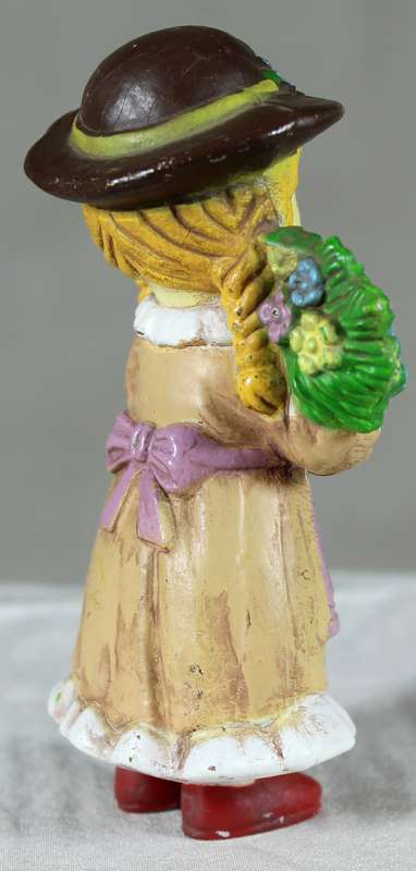 Pigtail girl holding flowers