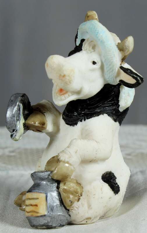 Molded small cow with milk can