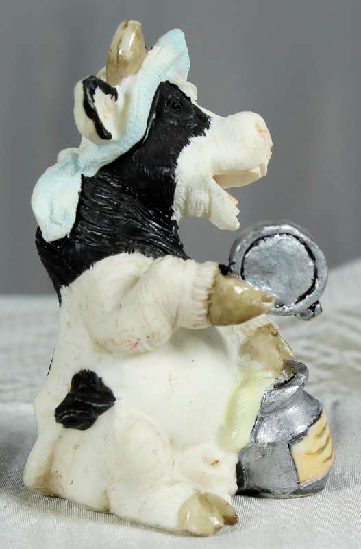 Molded small cow with milk can