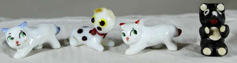 Set of four miniature cats