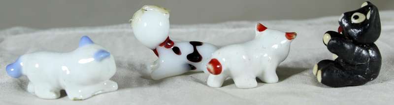 Set of four miniature cats