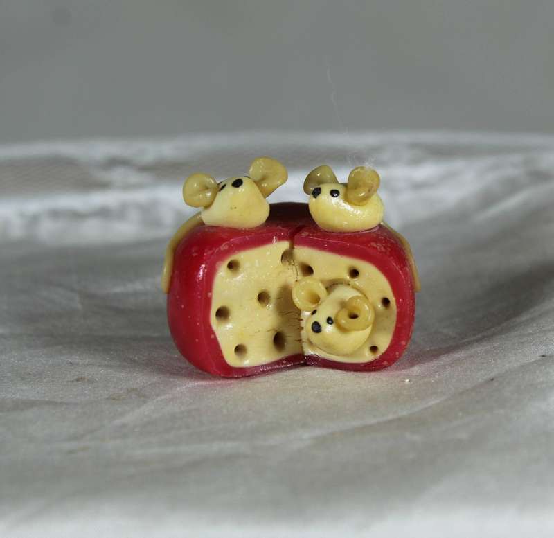 Mini miniature trio of mice in a roll of cheese