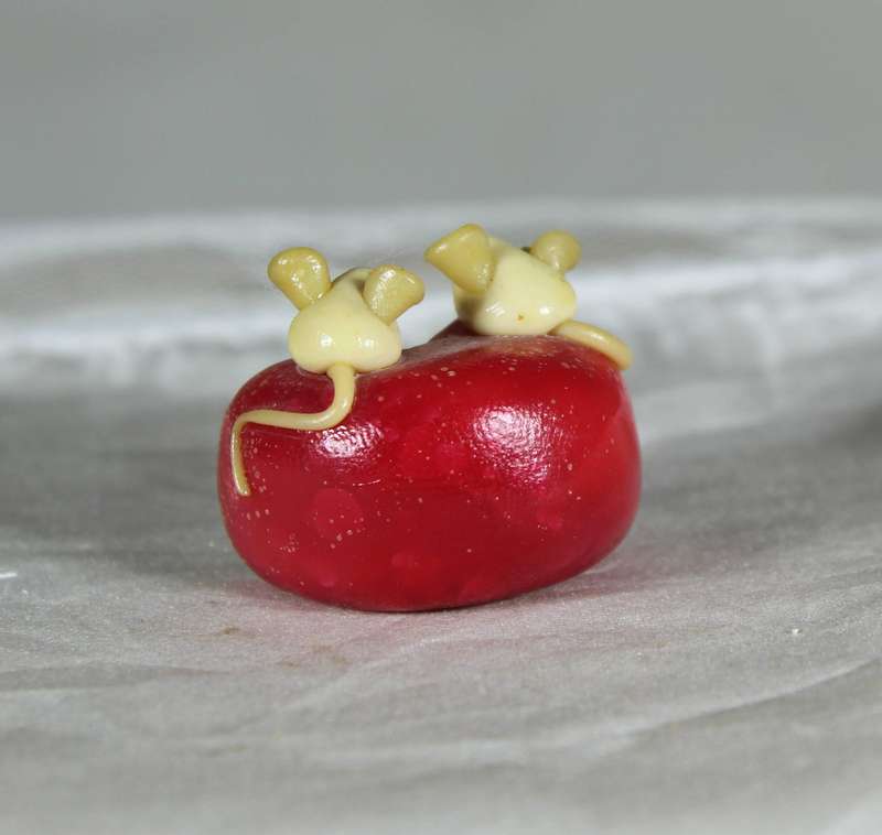 Mini miniature trio of mice in a roll of cheese