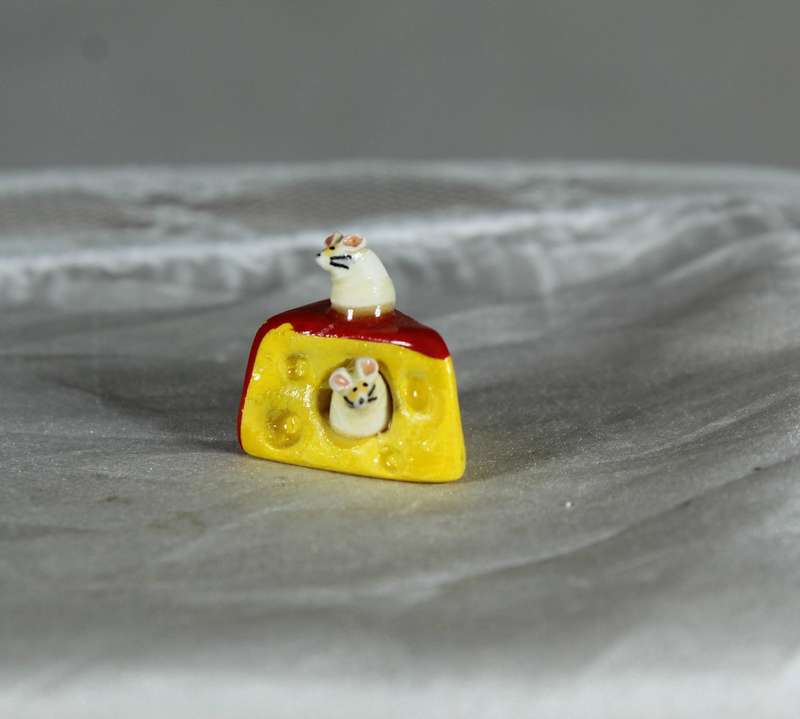 Mini miniature mice in a slice of cheese, by Fay