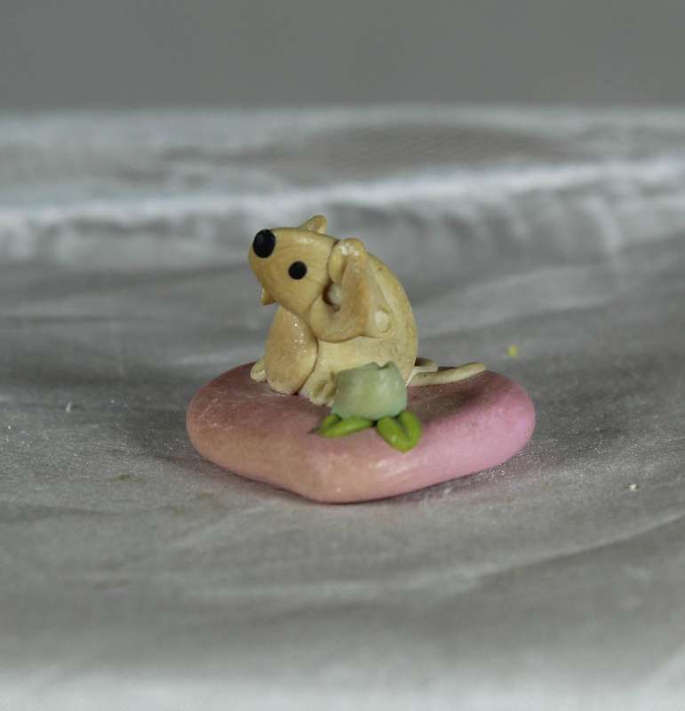 Mini miniature mouse on a pink heart