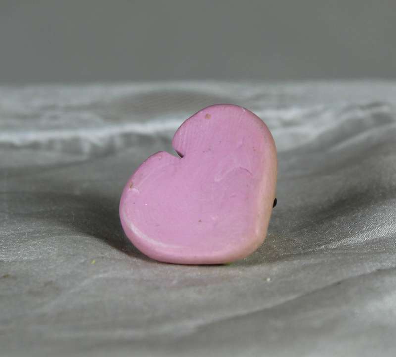 Mini miniature mouse on a pink heart