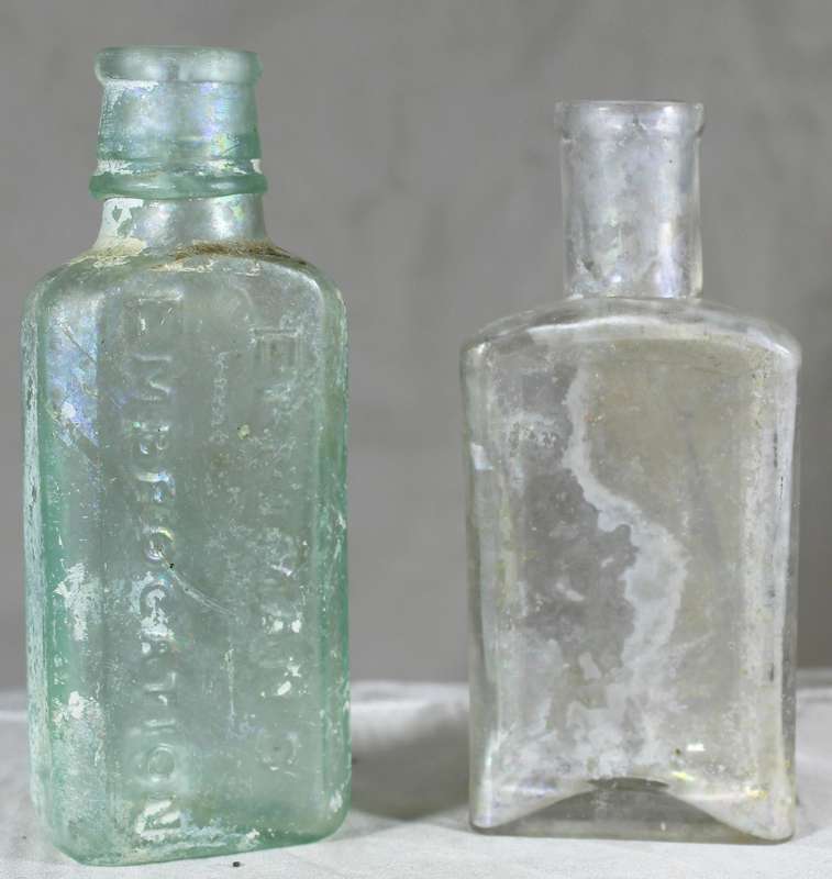 Pair of glass vintage bottles
