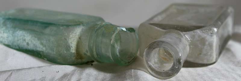 Pair of glass vintage bottles