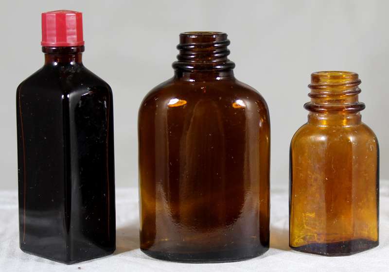 Trio of vintage glass bottles