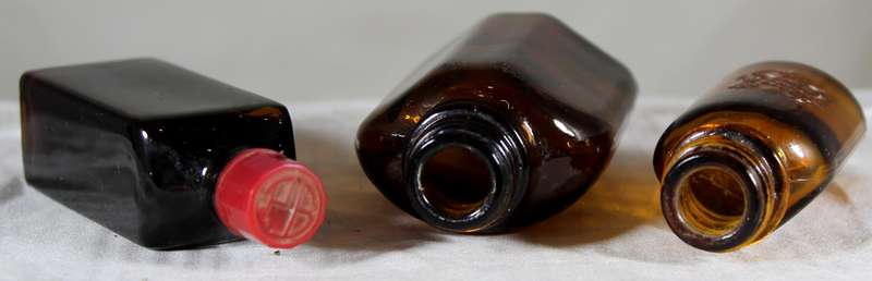 Trio of vintage glass bottles