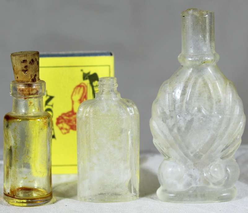 Trio of vintage glass bottles