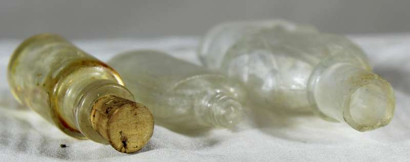 Trio of vintage glass bottles