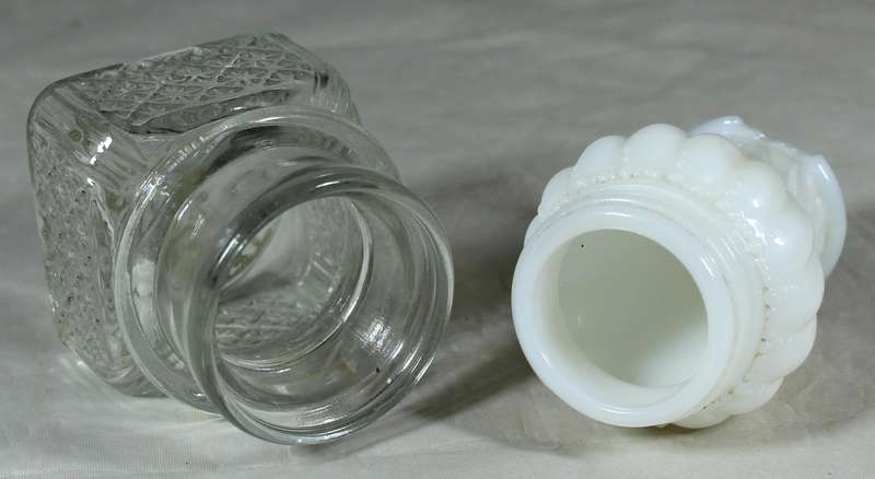 White glass bottle plus pressed glass bottle