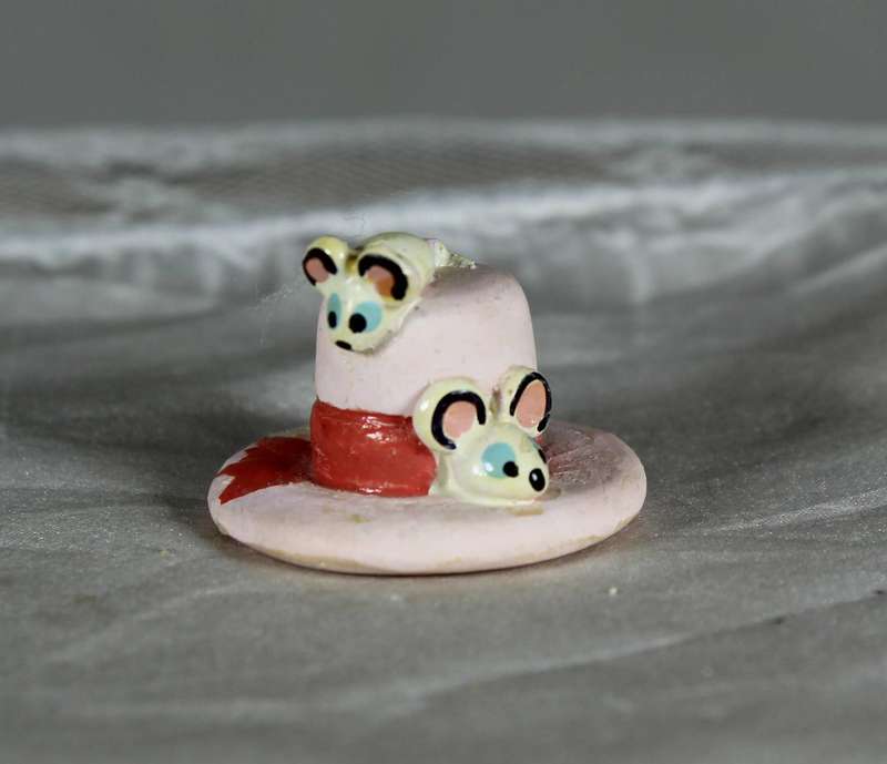 Mini miniature trio of mice on a cake