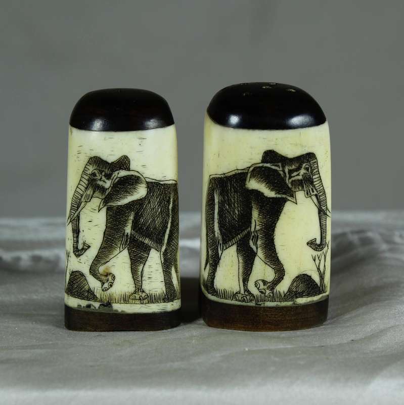 Bone salt & pepper set with engraved elephant motif