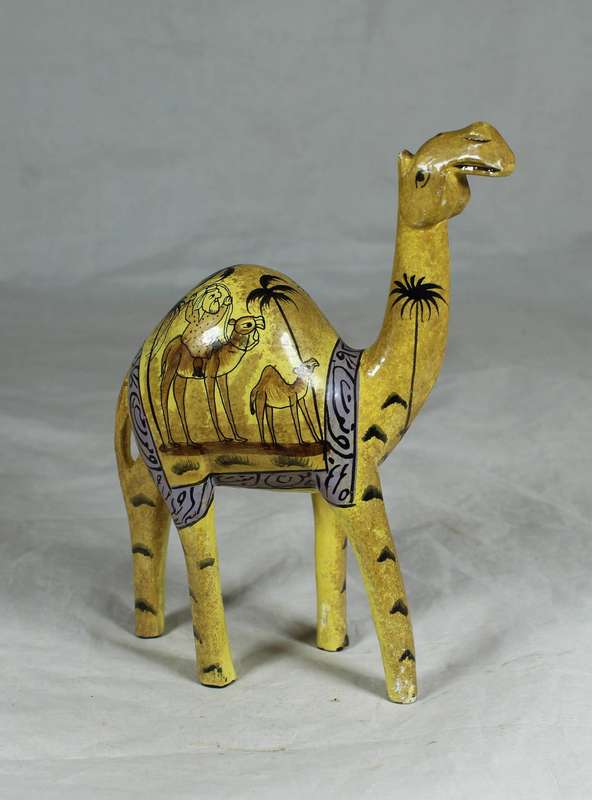 Camel with painted desert scenes
