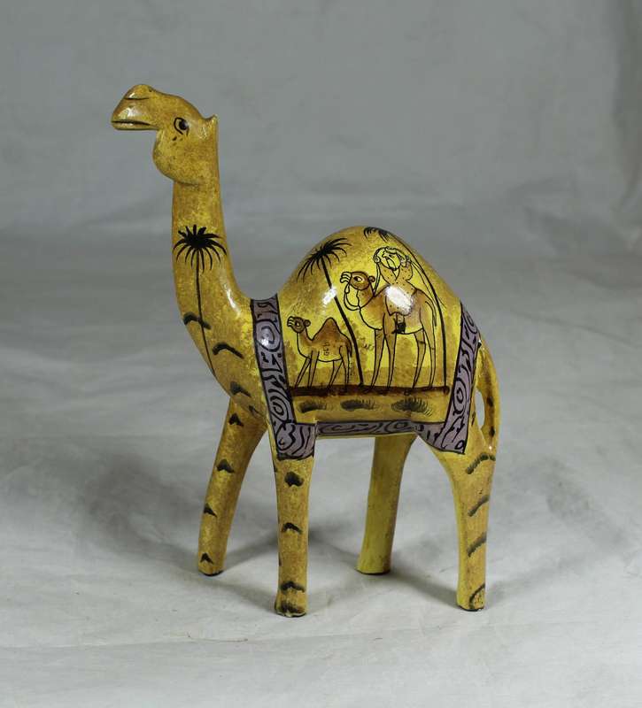 Camel with painted desert scenes