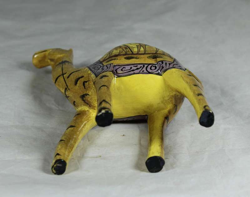Camel with painted desert scenes