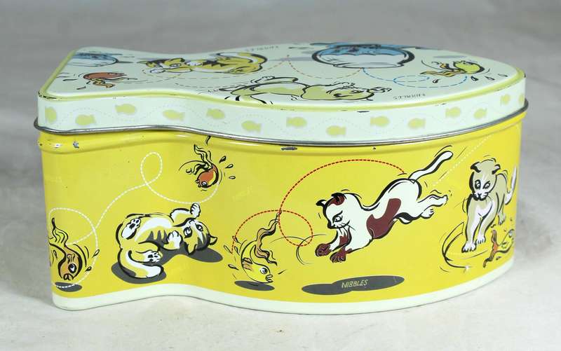 Tin in the shape of a fish with cats playing