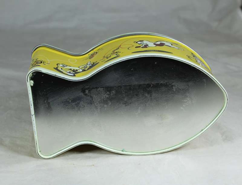 Tin in the shape of a fish with cats playing