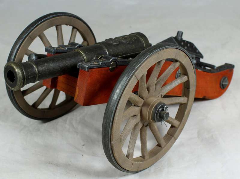 Highly detailed cannon desk lighter on wood base with ammo box