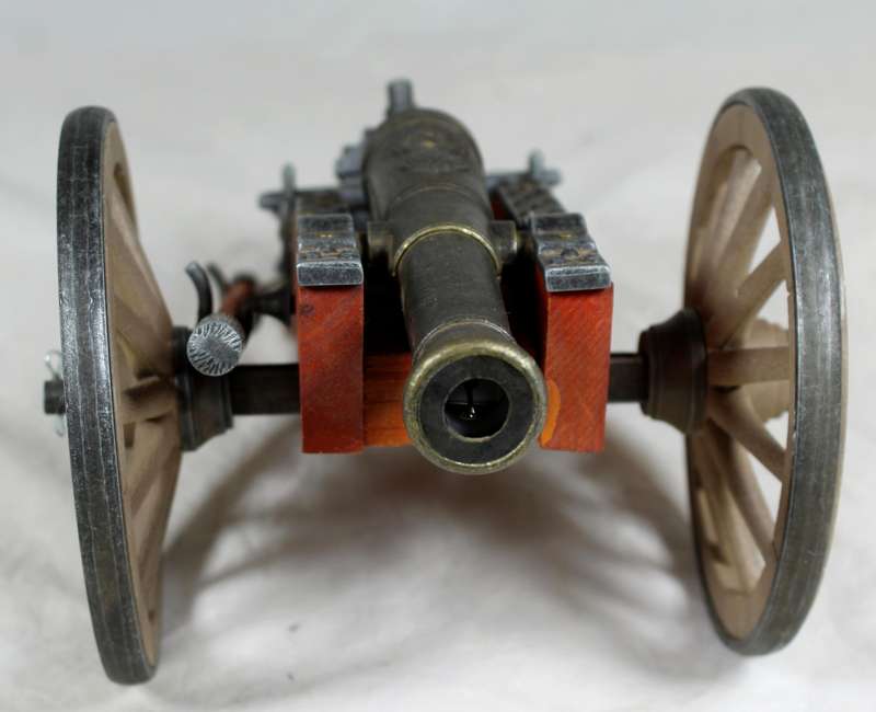 Highly detailed cannon desk lighter on wood base with ammo box
