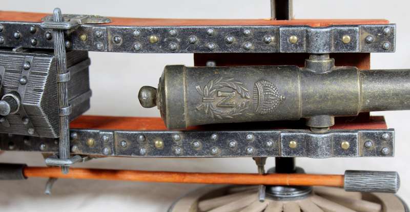 Highly detailed cannon desk lighter on wood base with ammo box