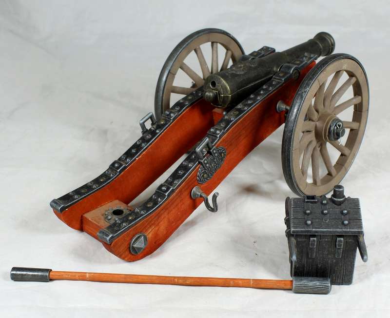 Highly detailed cannon desk lighter on wood base with ammo box
