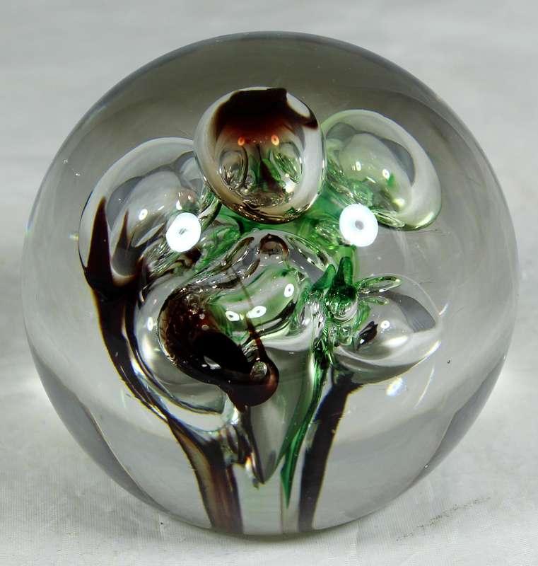 Glass paperweight with colorful bubbles