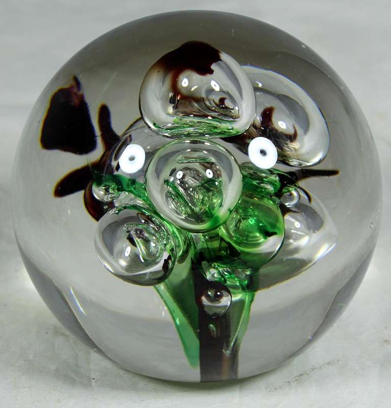 Glass paperweight with colorful bubbles
