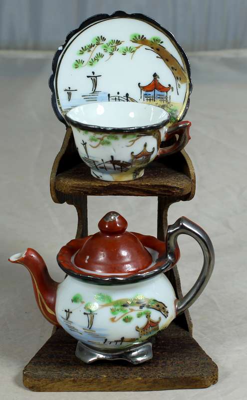 Miniature Chinese tea set on stand