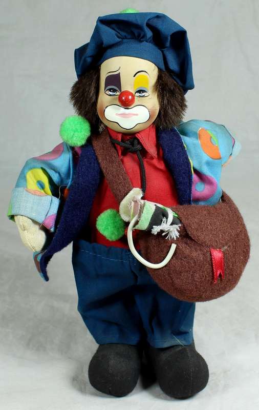 Tramp clown with a sling bag