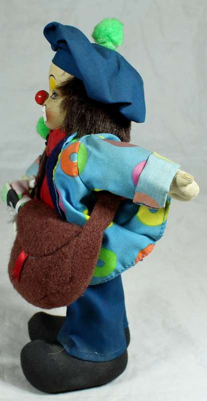 Tramp clown with a sling bag