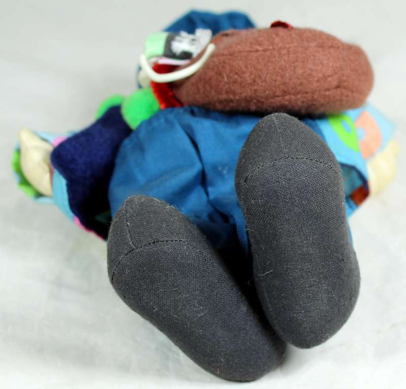 Tramp clown with a sling bag