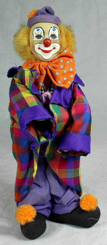 Smiling clown in multi color jacket