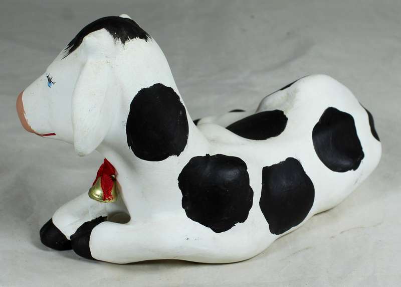 Smiling cow laying down