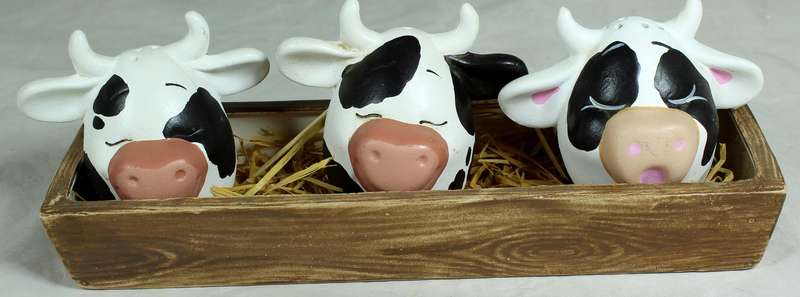 Cow head salt & pepper shakers in a trough