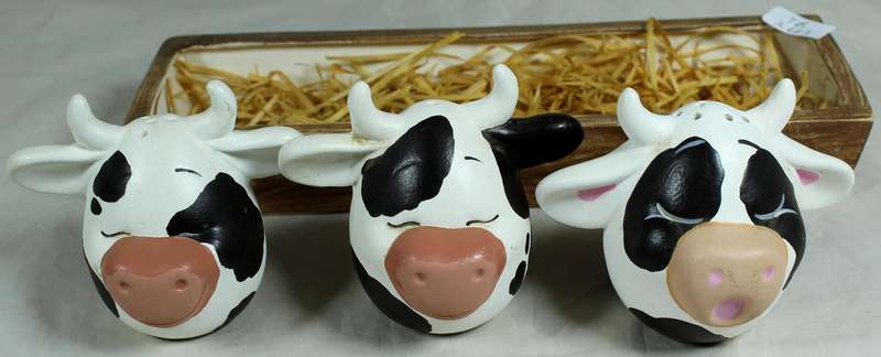 Cow head salt & pepper shakers in a trough