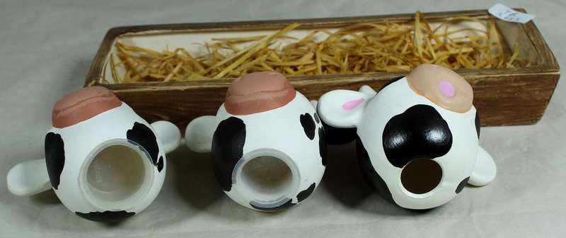 Cow head salt & pepper shakers in a trough