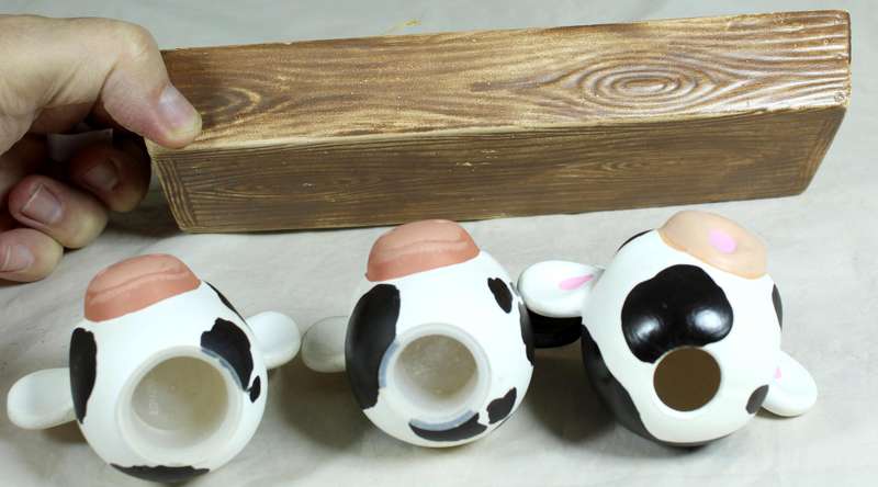 Cow head salt & pepper shakers in a trough