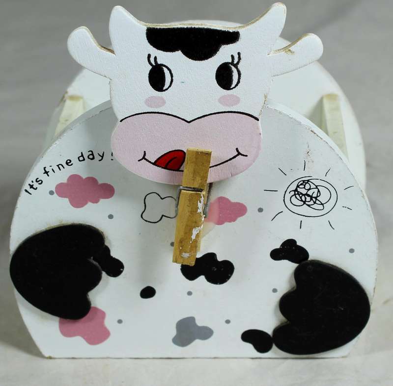 Wooden cow trinket holder with paper clip