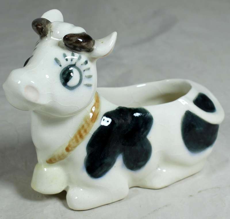 Cow laying down trinket holder