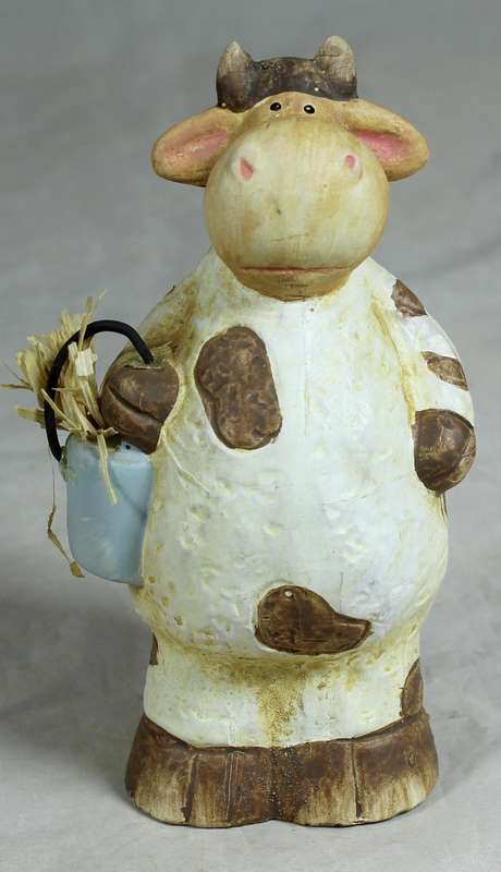 Ceramic cow holding a bucket