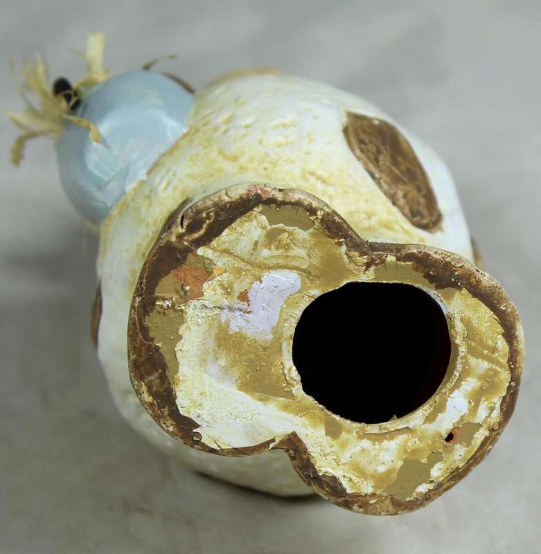 Ceramic cow holding a bucket