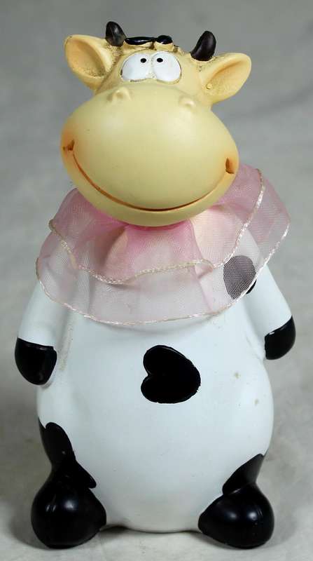 Ceramic cow with pink satin