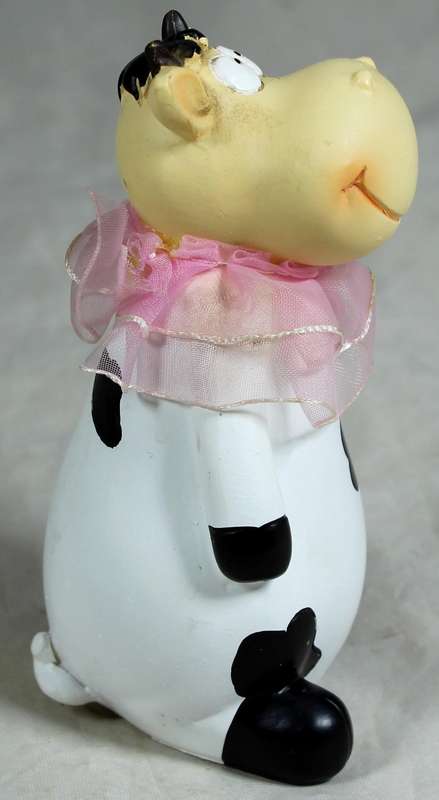 Ceramic cow with pink satin