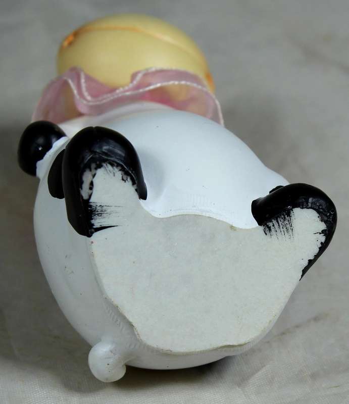 Ceramic cow with pink satin